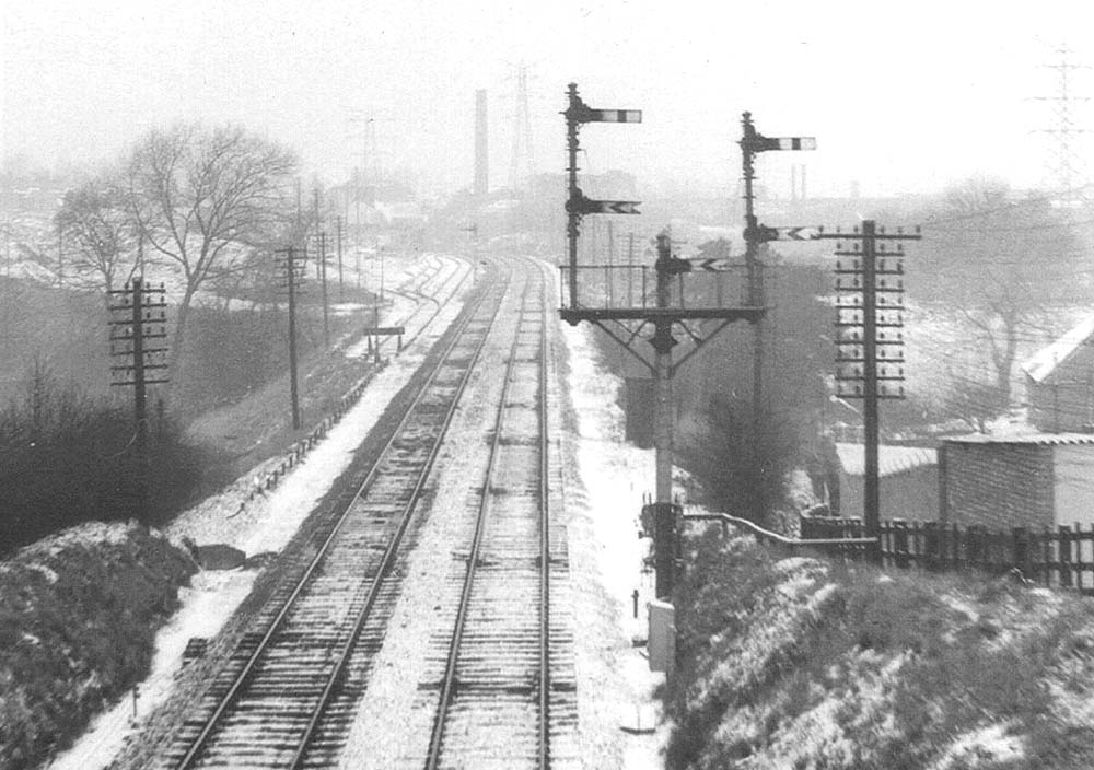 A wintry view looking north along the main line towards Bournville, taken from Breedon Road bridge on 8th March 1962
