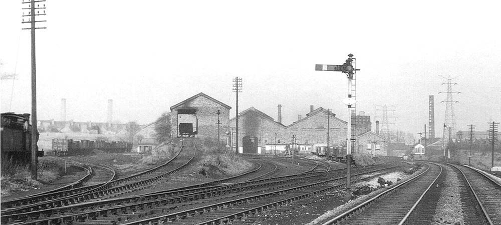 A view of Bournville shed and yard, including the coaling stage, taken from the main line on 21st December 1958