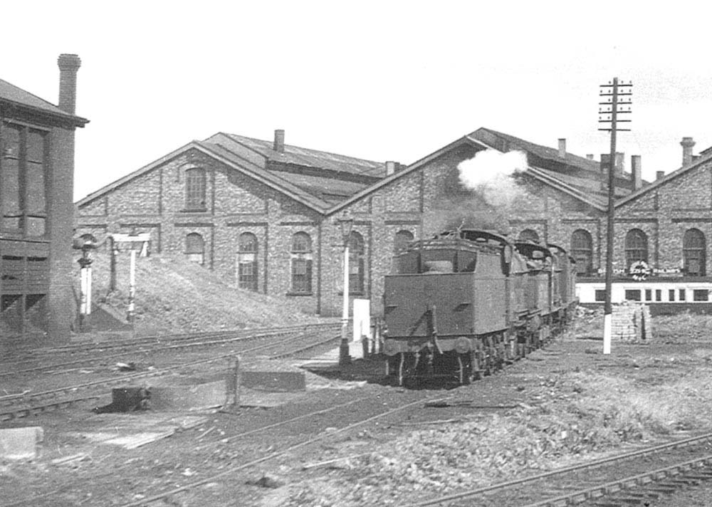 Close up showing three unidentified ex-LMS engines on the short siding often occupied by wagons loaded with ash