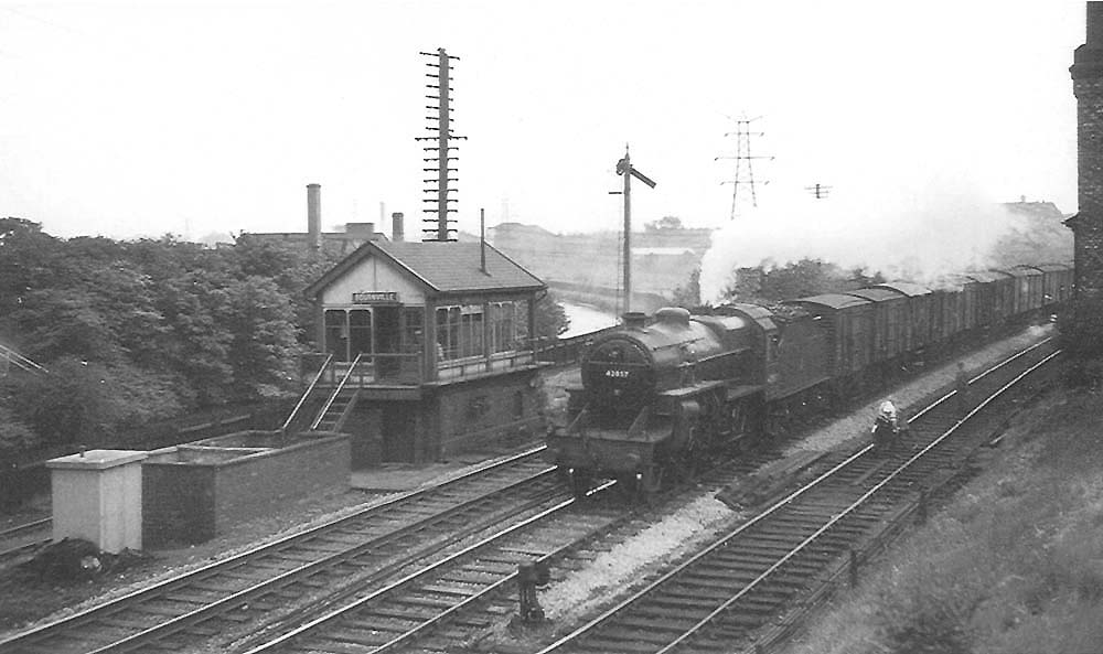 A view of Crab 2-6-0 No 42857 powering a semi-fitted express freight in the Birmingham direction, taken in 1953