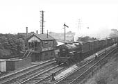 A view of Crab 2-6-0 No 42857 powering a semi-fitted express freight in the Birmingham direction, taken in 1953