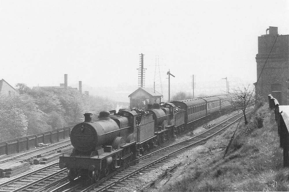 Two Fowler 4-4-0s, 4P No 41075 piloting 2P No 40409, double heading an up stopping train past Bournville signal box