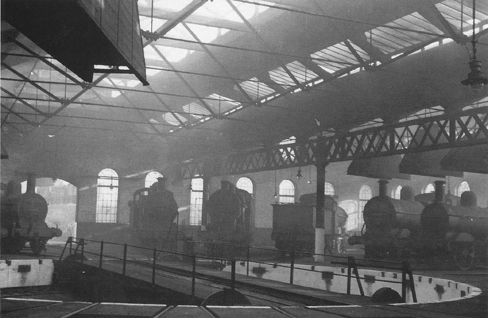 A line up of mainly ex-MR locomotives, with one ex-LMS interloper, stand inside Bournville roundhouse in September 1957