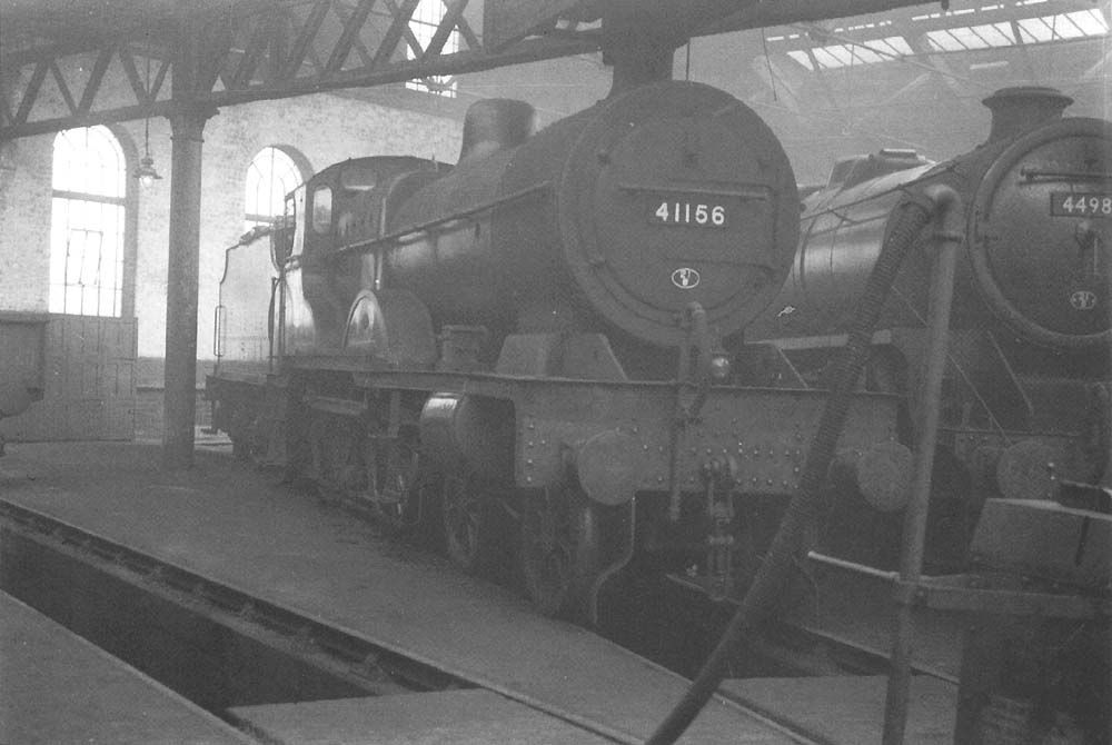 Ex-LMS 4P 4-4-0 Compound No 41156 and ex-LMS 4-6-0 No 44981 stand inside the shed on 31st July 1958