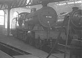 Ex-LMS 4P 4-4-0 Compound No 41156 and ex-LMS 4-6-0 No 44981 stand inside the shed on 31st July 1958