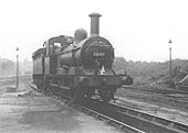 A view of ex-MR 2F 0-6-0 No 58167, standing over the ash pit outside Bournville shed in May 1959