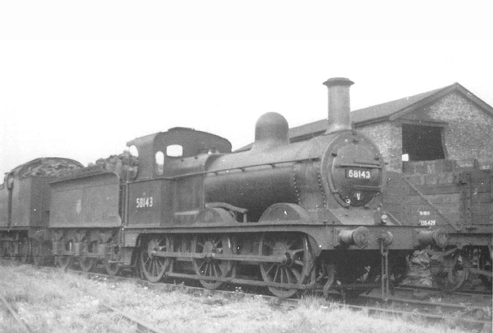 A clean looking ex-MR 2F 0-6-0, No 58143, is seen on one of the sidings behind the coaling stage in the fifties