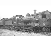 A clean looking ex-MR 2F 0-6-0, No 58143, is seen on one of the sidings behind the coaling stage in the fifties