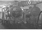 Ex-MR 3F 0-6-0 No 43359 and ex-LMS 4F 0-6-0 No 44571 simmer in steam inside the shed during the late 1950s