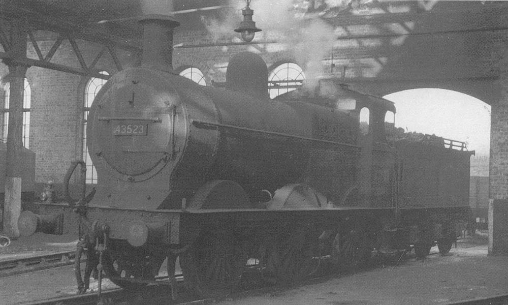 Ex-MR 3F 0-6-0 No 43523, another veteran from the Johnson era, is seen in steam inside the shed on 30th March 1958