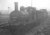 Withdrawn ex-MR 2F 0-6-0 No 58126 is seen on a short siding near the main line on Friday 1st June 1956