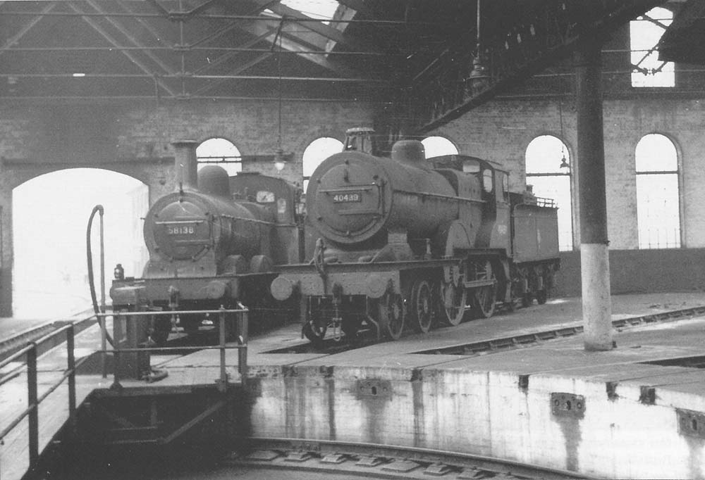 A view inside the roundhouse of two ex-Midland Railway engines, taken in the late fifties