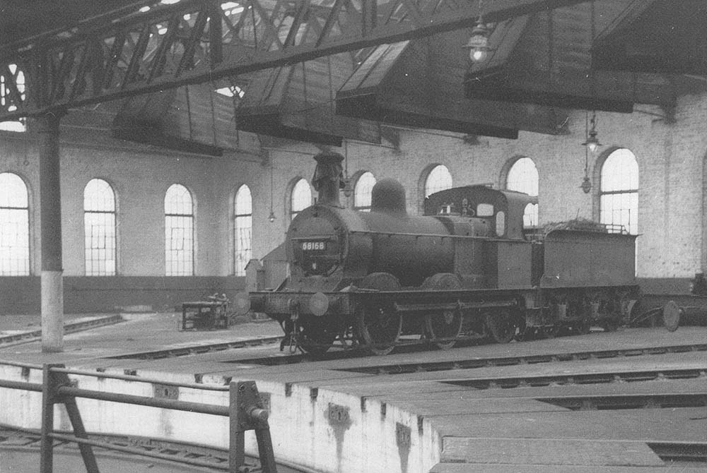 Ex-MR 2F 0-6-0 No 58168 is seen inside the roundhouse at Bournville on Sunday 27th December 1959