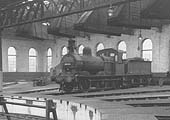 Ex-MR 2F 0-6-0 No 58168 is seen inside the roundhouse at Bournville on Sunday 27th December 1959