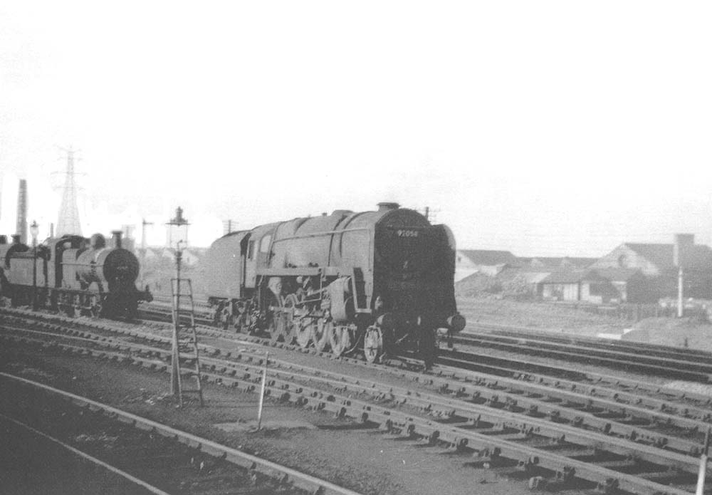 View of BR Standard 9F 2-10-0 No 92058, probably leaving the shed, taken in the  summer of 1959