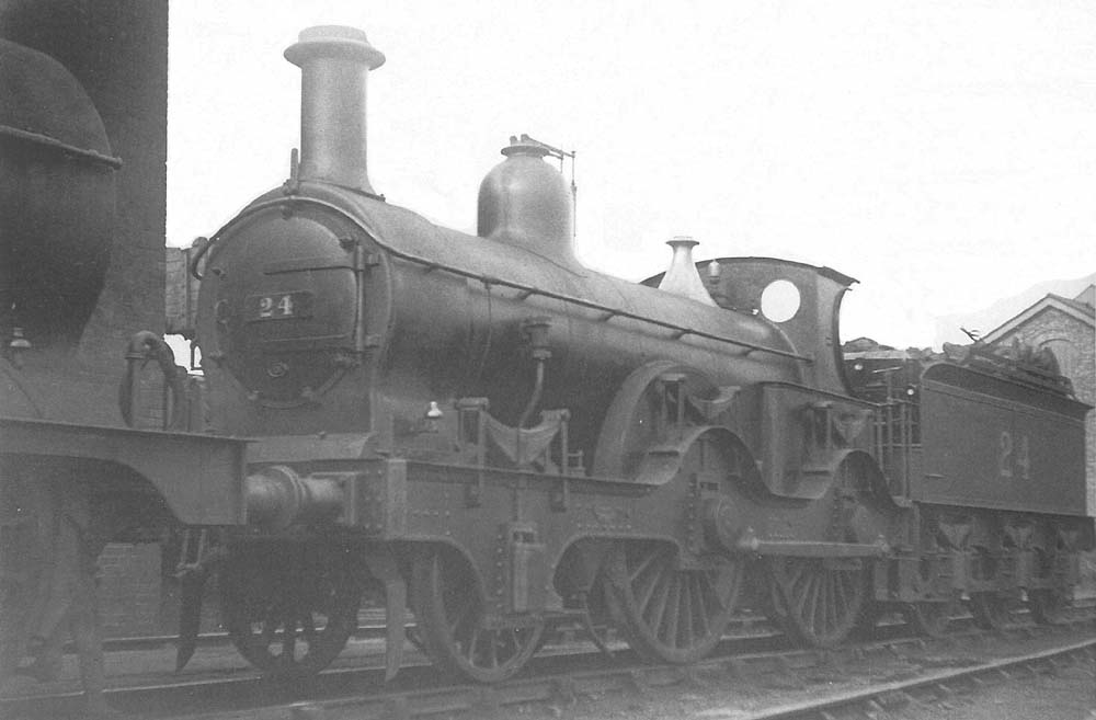 Ex-MR 2-4-0 800 class No 24 stands in line outside the shed on the ash pit road ready for its next trip in February 1921