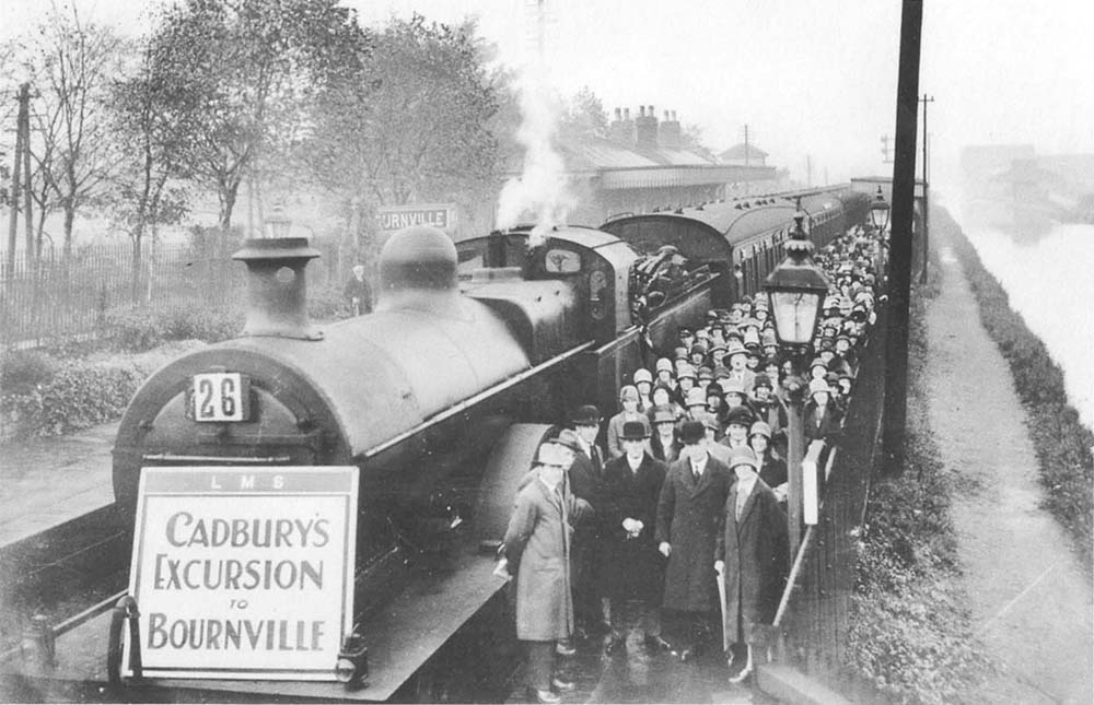 An LMS Cadbury's excursion to Bournville has arrived at the down platform, headed by an ex-MR  3P 4-4-0