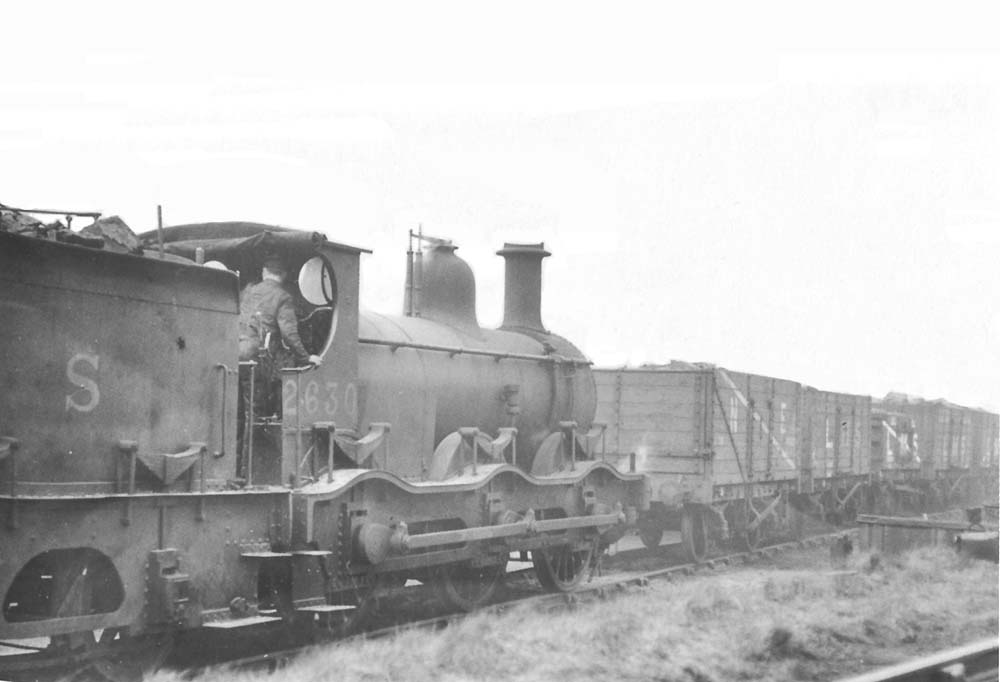 Ex-MR 1F 0-6-0 No 2630, another Kirtley veteran, is seen shunting loco coal for Bournville shed on 2nd March 1935