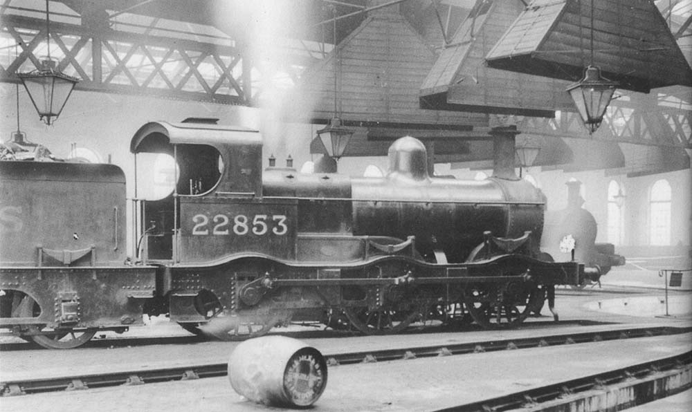 Ex-MR 2F Kirtley 0-6-0 No 22853, another of Bournville's Victorian veterans, stands inside the shed on 9th May 1936