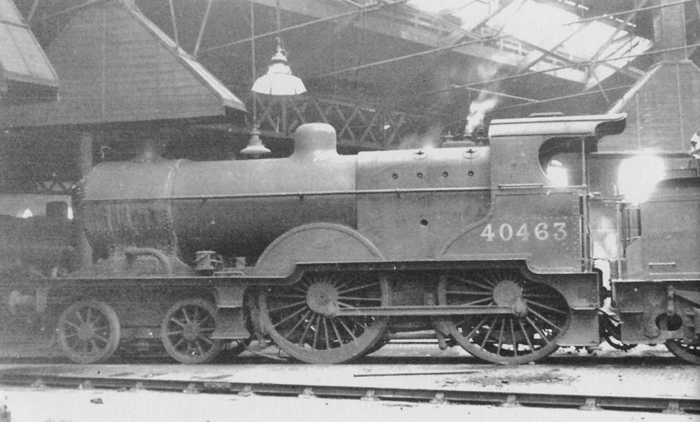 Ex-MR 2P 4-4-0 483 class No 40463 stands in side the shed with steam rising from its safety valves 24th September 1950