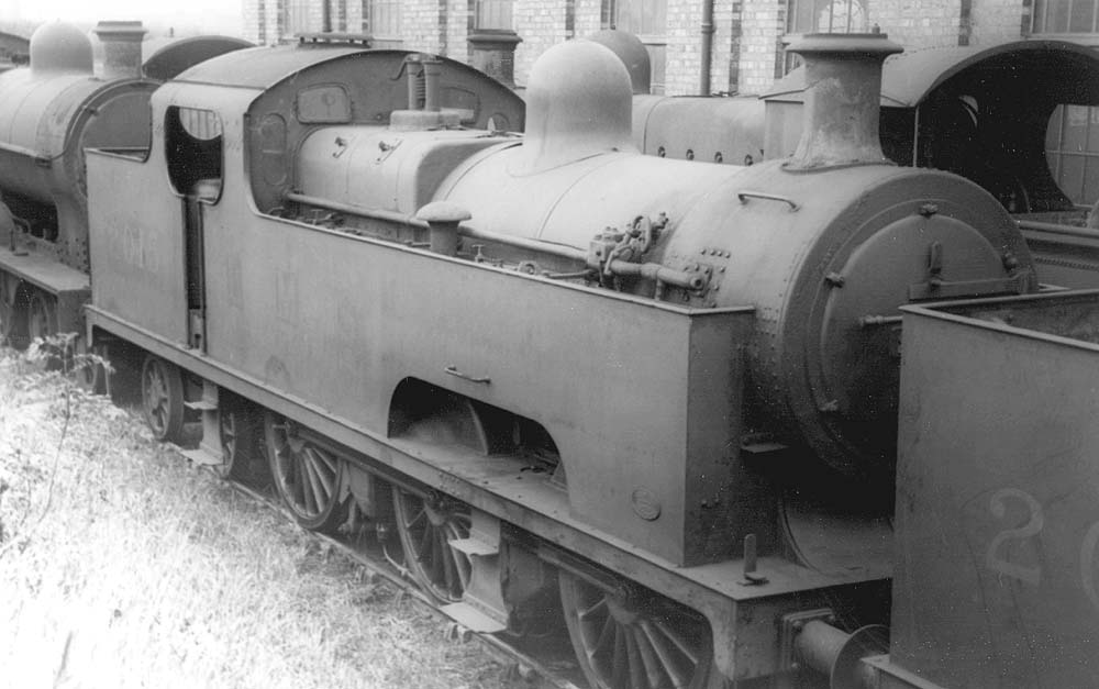 LMSR 3P 0-6-4T No 2015 stands with other engines in a siding alongside the shed at Bournville on Saturday 15th June 1935