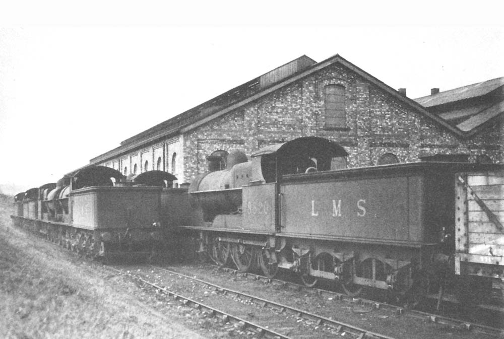 Seven ex-LNWR 19" goods 4-6-0s are stored out of use in the two sidings beside the shed on Sunday 17th March 1935