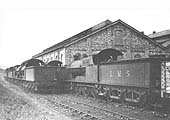 Seven ex-LNWR 4-6-0s are stored out of use in the two sidings beside the shed on Sunday 17th March 1935