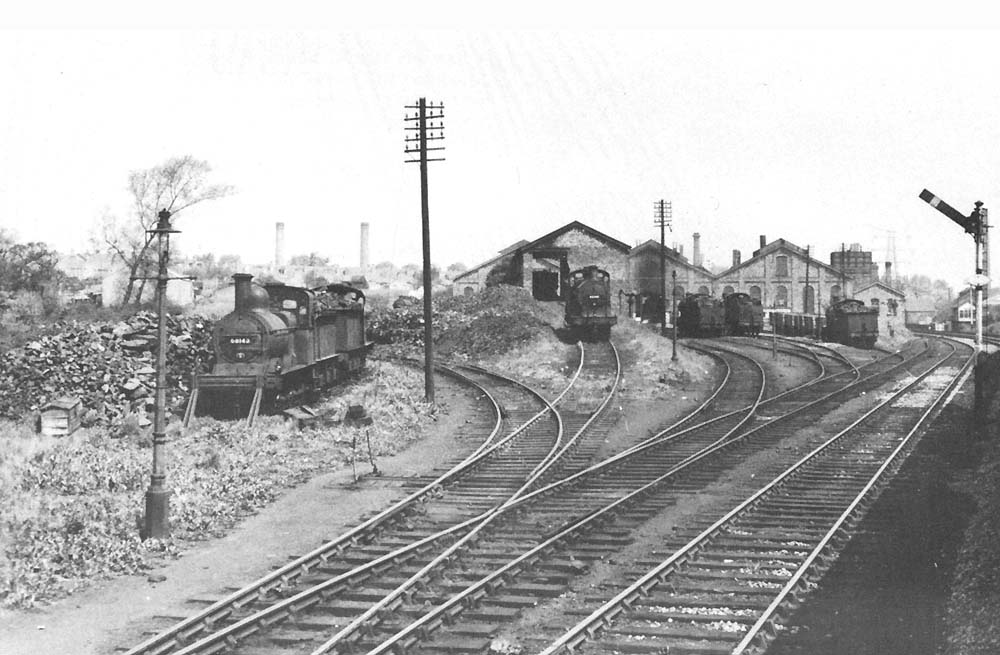 Diverging tracks serving the shed and yard at Bournville were photographed from a northbound train on Saturday 1st June 1957