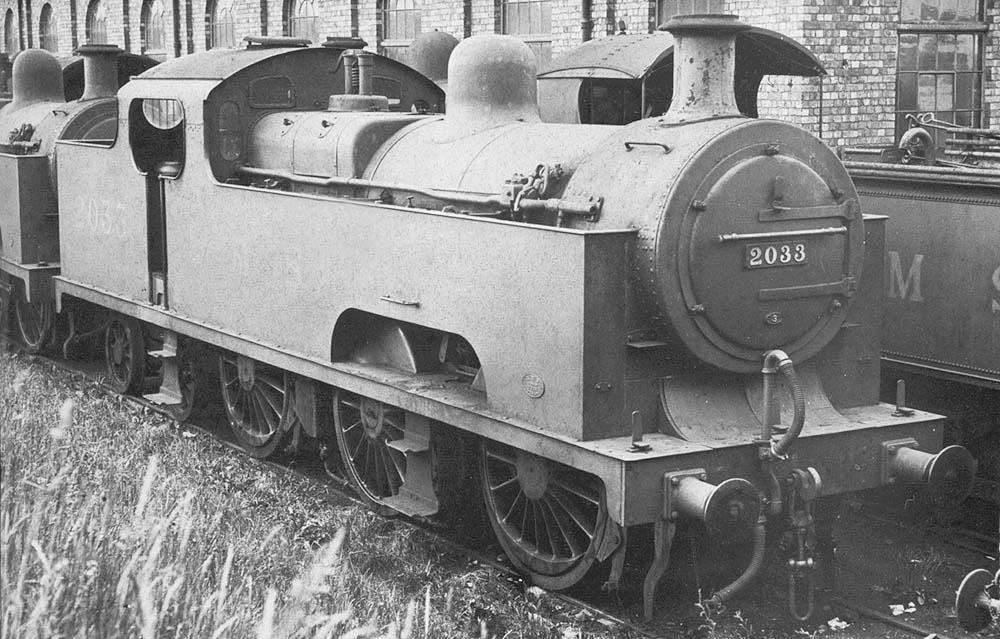 Ex-MR 3P 0-6-4T No 2033 stands with other engines in a siding alongside the shed at Bournville on Saturday 15th June 193