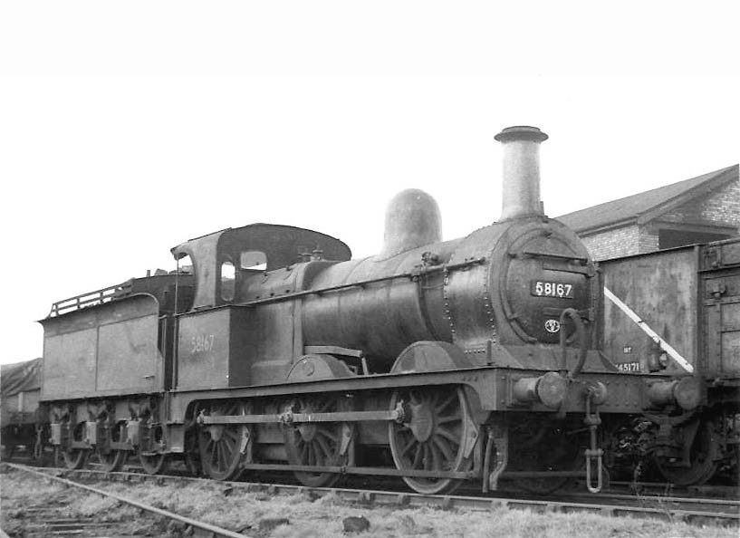Ex-MR 2F 0-6-0 No 58167 is seen on a siding behind the coal stage at Bournville on 17th February 1957