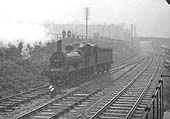 A view of ex-MR 2F 0-6-0 No 58126 departing from its home shed on Monday 27th April 1953