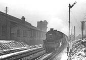 British Railways 5MT 4-6-0 No. 45297 passes Bournville shed as it heads southwards on the cold morning of Sunday 19th February 1956