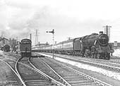 Ex-LMS 5MT 4-6-0 No 44813 heads at least eleven coaches southwards past Bournville shed on 5th September 1955