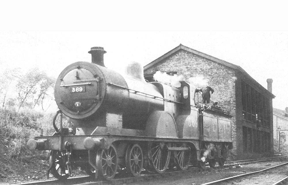LMSR 2P 4-4-0 No 369 is taking on water at Bournville shed on a warm summer's day in 1938