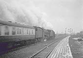 A pair of ex-LMS 4-6-0 locomotives pass through the station on a Bristol to Newcastle express