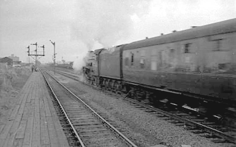An unidentified ex-LNER A1 4-6-2 locomotive passes through the station on a York bound express in 1963
