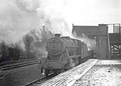 Ex-LMS 8F 2-8-0 No 48720 is passing through Bromford Bridge on eastbound freight circa 1962