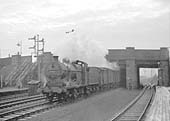 An unidentified ex-LMS 4F 0-6-0 rattles through Bromford Bridge on an up Class D freight service