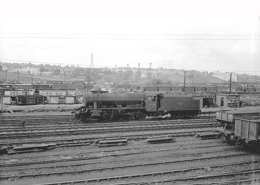 Ex-LMS 8F 2-8-0 No 48220 drifts slowly light engine through Washwood Heath extensive sidings