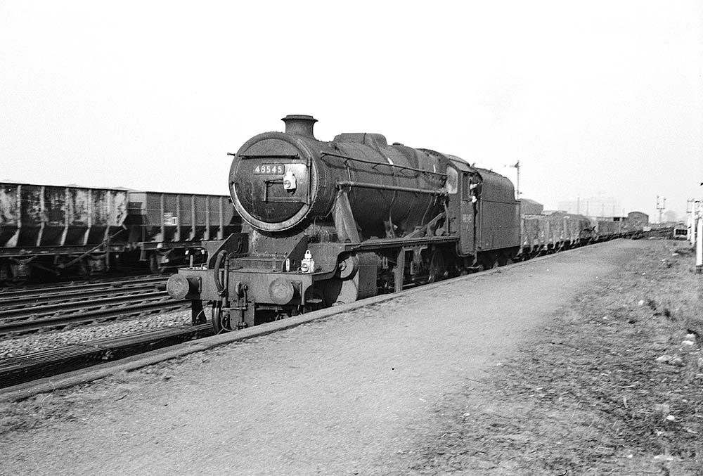 Ex-LMS 8F 2-8-0 No 48545 passing through Bromford Bridge Station at the head of a down Type 7 service