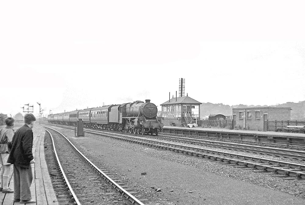 Ex-LMS 5MT 4-6-0 No 45440 passes Bromford Bridge Station with a Class A down express service on 22nd June 1957
