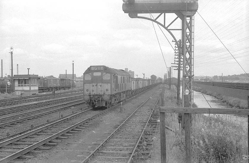 An unidentified 'Brush' Type 2 Diesel locomotive approaches Bromford Bridge with a down coal train in 1963