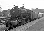 Ex-LMS 5MT 4-6-0 No 48694 passes through the station on an up Type 7 express freight service
