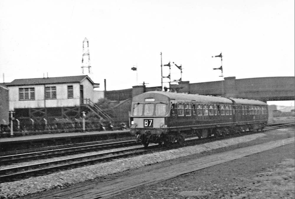 A two-car Diesel Multiple Unit passes through the station on its way to Leicester via Nuneaton Abbey Road