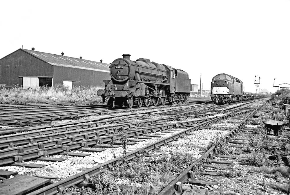 Ex-LMS 5MT 4-6-0 No 44855 runs light engine to Saltley shed past an English Electric Type 4 1Co-Co1 Diesel locomotive