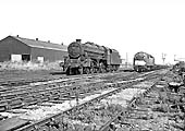 Ex-LMS 5MT 4-6-0 No 44855 runs light engine to Saltley shed past an English Electric Type 4 1Co-Co1 Diesel locomotive