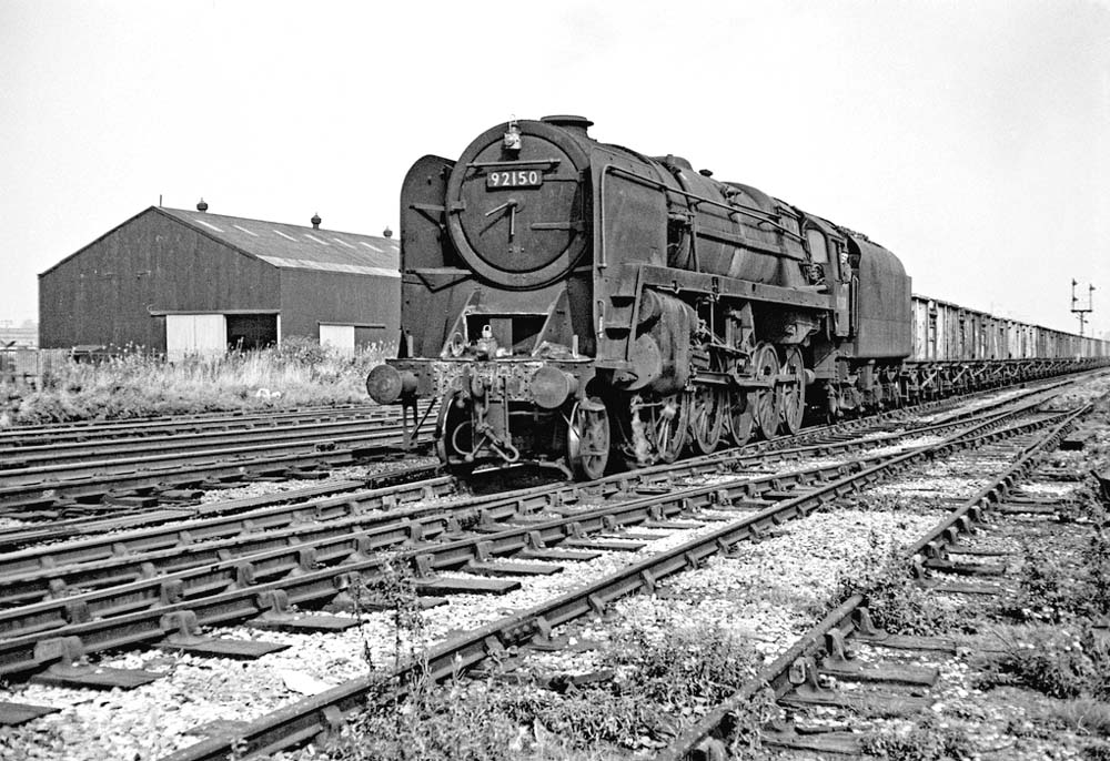 British Railways 9F 2-10-0 No 92150 passes through Bromford Bridge on a down Class H through freight service