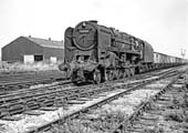 British Railways 9F 2-10-0 No 92150 passes through Bromford Bridge on a down Class H through freight service