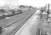 Looking  towards Water Orton from the down platform with ex-LMS 4F 0-6-0 No 44180 running tender first on an up goods service