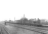 Ex-LMS 0-6-0 4F No 43835 is seen at the head of a down Class H goods train passing through Bromford Bridge station on 30th August 1952